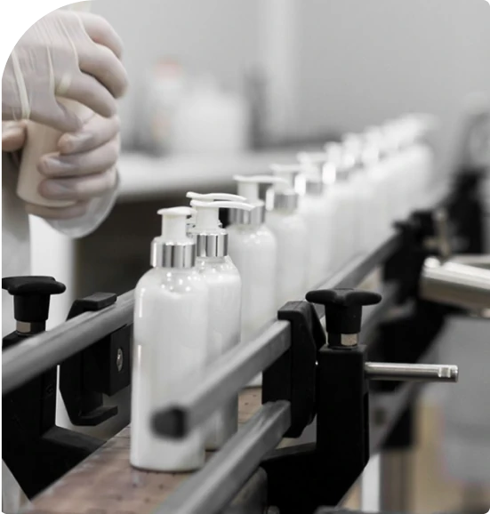 cosmetic manufacturer showcase hand cream bottles on a conveyor belt