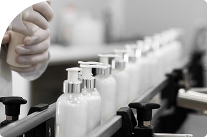 cosmetic manufacturer showcase hand cream bottles on a conveyor belt